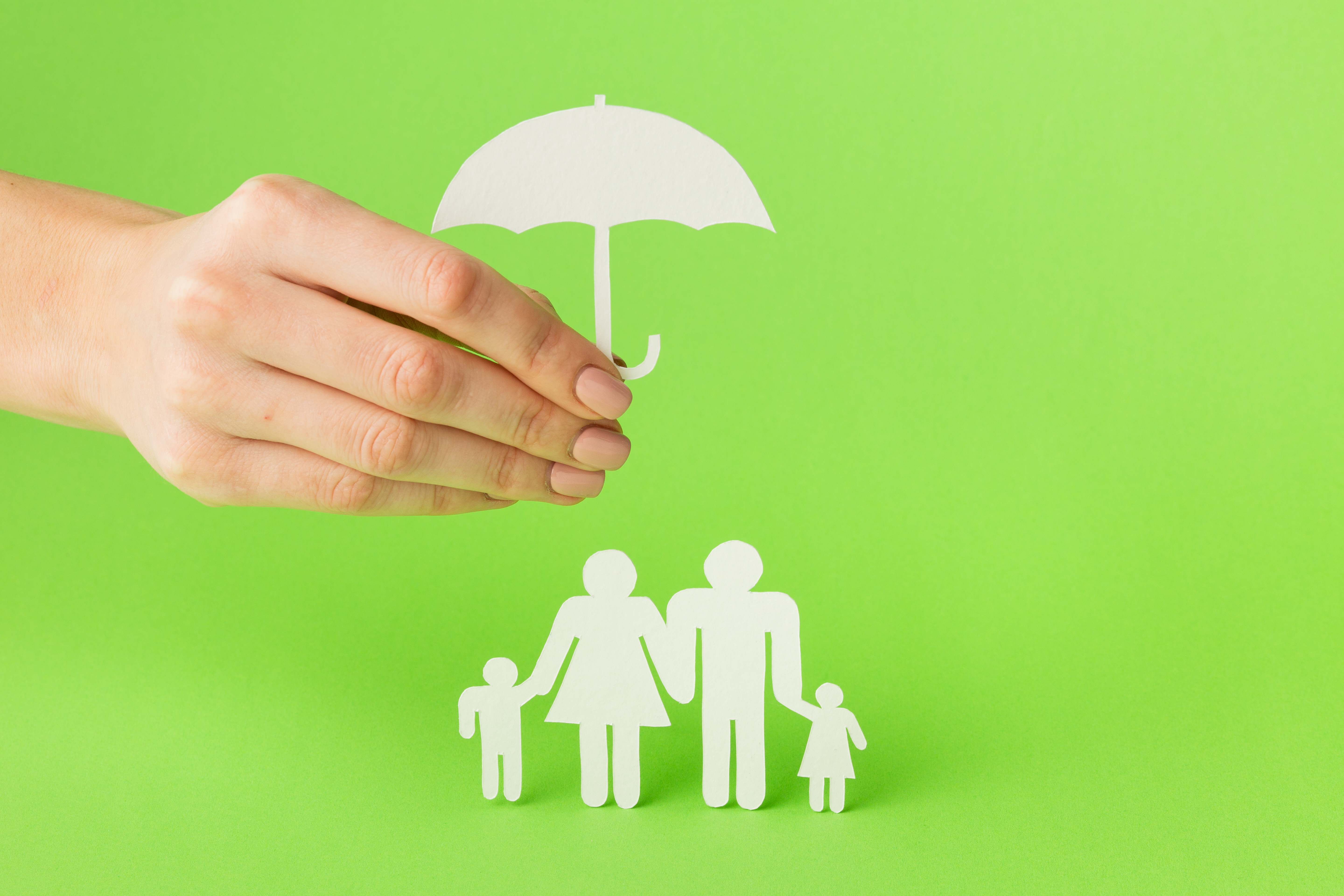 close-up-hand-with-paper-cut-family-concept